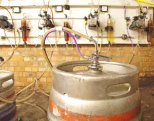kegs of beer in a cellar
